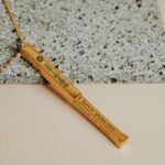 Secret message engraved necklace with spotify